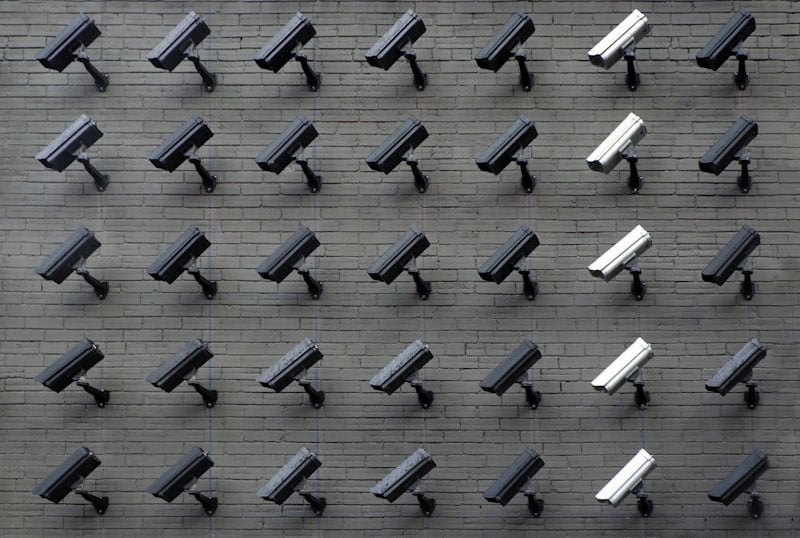 Outdoor security camera mounted on wall