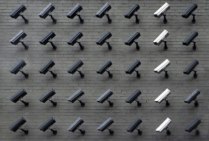 Outdoor security camera mounted on wall