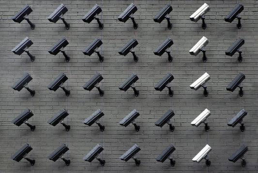 Outdoor security camera mounted on wall